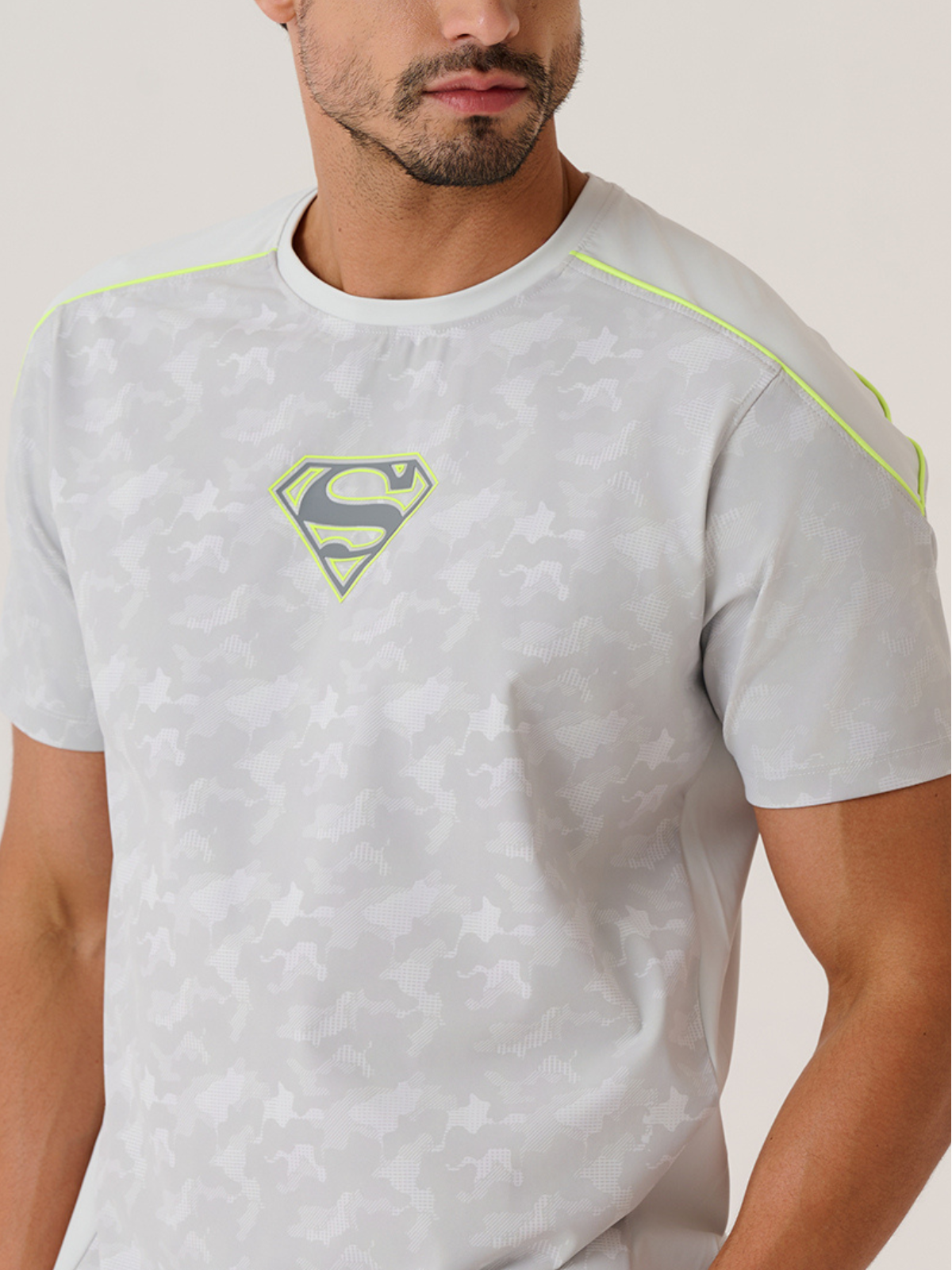 Close-up of the tone-on-tone camo Superman S logo on the STRCH Foggy Dew tee